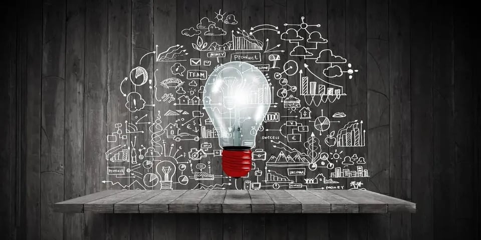 Light bulb and drawing business strategy at background
